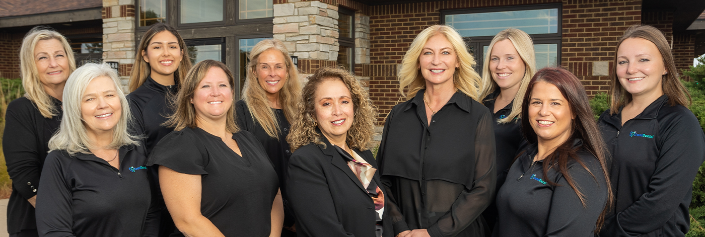 The smiling Sycamore dental team at Grand Dental - Prairie View